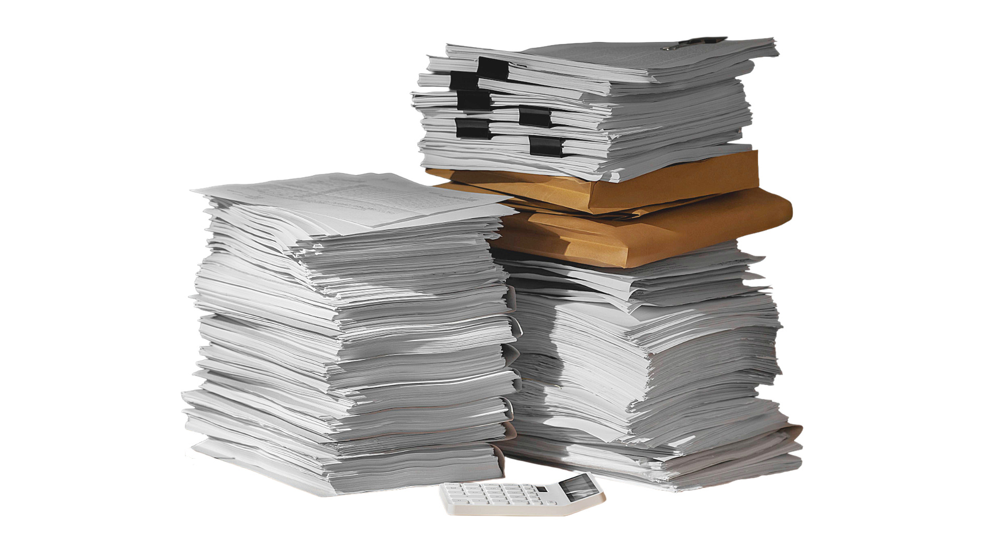 Stack of exam papers and a calculator